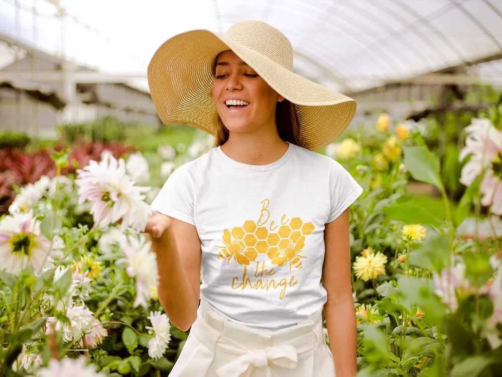 mockup-of-a-happy-girl-wearing-a-tshirt-and-a-sun-hat-in-a-greenhouse-22500_2_1024x1024@2x