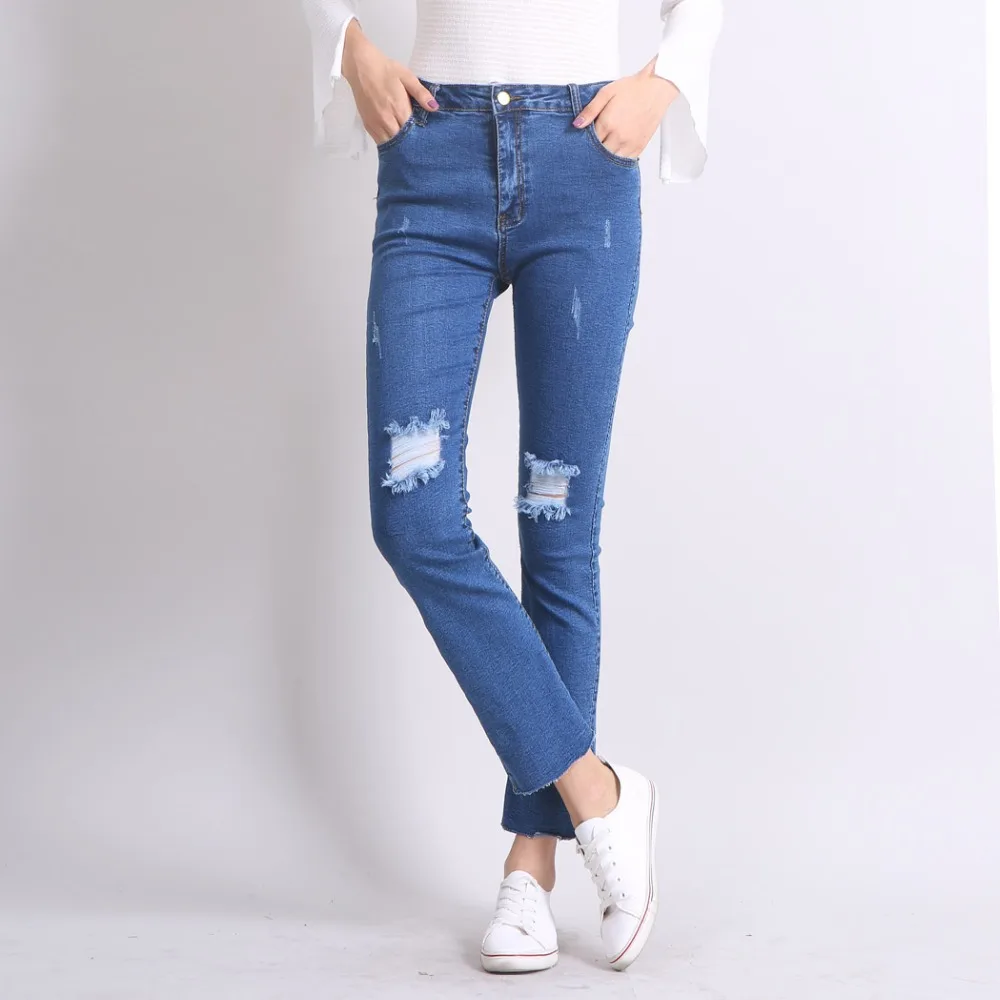 flared ripped knee jeans