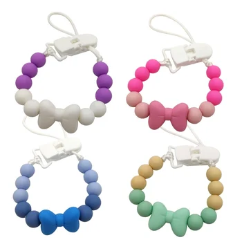 

High Quality New Baby Colorful Solid Pacifier Chain Kids Silicone Dummy Clip Holder Cute Bowknot Pacifier Clips Soother Chains