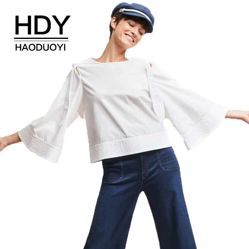 

HDY Haoduoyi Solid White Women Casual Sweet Shirts Flare Sleeve Hollow Out Shoulder Lace Up Zipper Female Elegant Blouses