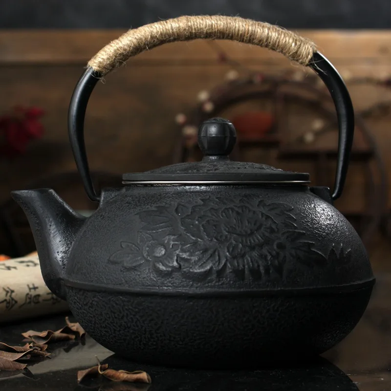 

Free shipping 900ML Cast Iron Pot Uncoated Iron Teapot Japan Peony Big Kettle Drinkware Kung Fu Infusers Metal Net Filter