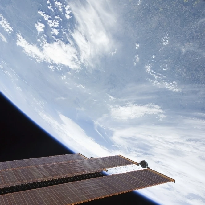 International Space Station solar array panels and planet Earth Poster Print (34 x 22)