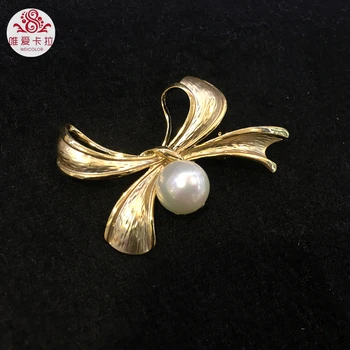 

WEICOLOR Lovely Bowknot Shaped 12mm Round White Mother Pearl Brooch.