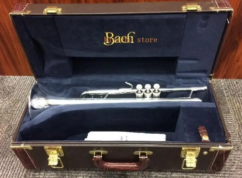 

two yanagisawa silver body and gold key + one bach trumpet