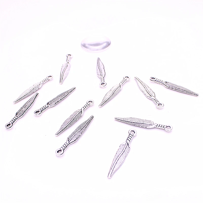 

Sweet Bell 150pcs 5*29mm Metal Small Feather Charms for Jewelry Making DIY Antique Brass Zinc Alloy Feather Pendant Charms D6054