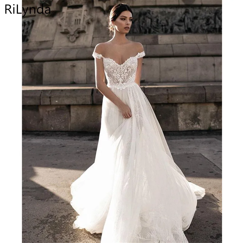 Sexy Trouwjurk Boho Lange Backless White Beach Wedding Dress Applicaties Lace V-hals Prinses Bruid Jurk Gratis Verzending Sexy Trouwjurk Boho Lange Backless White Beach Wedding Dress Applicaties Lace V-hals Prinses Bruid Jurk Gratis Verzending