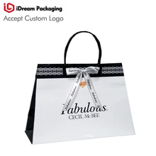 Трапециевидные бумажные пакеты с печатью логотипа ручка сумка глянцевая поверхность Пользовательский логотип Размер idreampackaging лучшее качество топ продаж