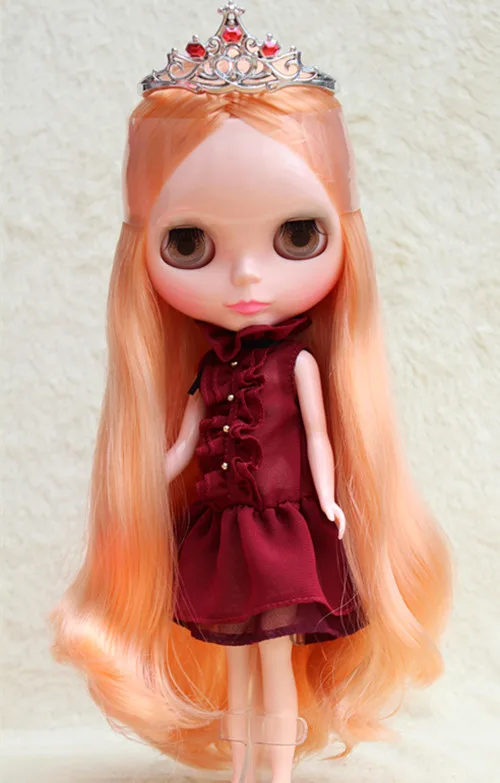 

Blyth doll,with orange hair,can changed into dark or transparent skin, and to jointed doll or other hair