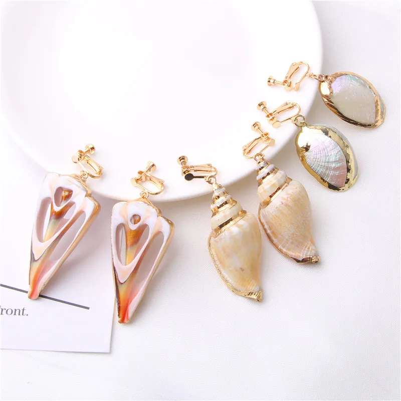 

Natural Sea Shell Earrings Gold Electroplate Clip Earrings Woman Gold Statement Ear Clip Irregular Pendant Earrings For Women