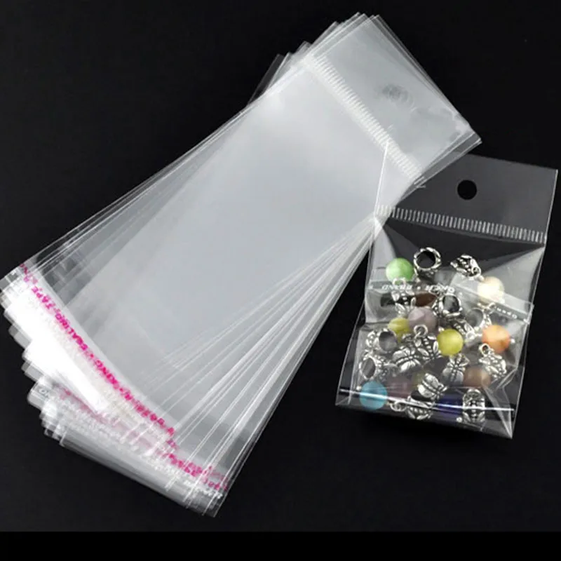 

Free Shipping 5000Pcs Transparent Self Adhesive Seal Plastic Bags With Hang Hole Whloesales 14x5cm (Usable Space 9x5cm)