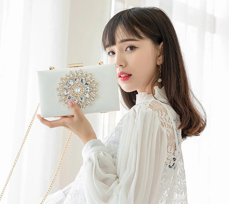 Model holding a Luxy Moon Luxury Rhinestone Evening Bag