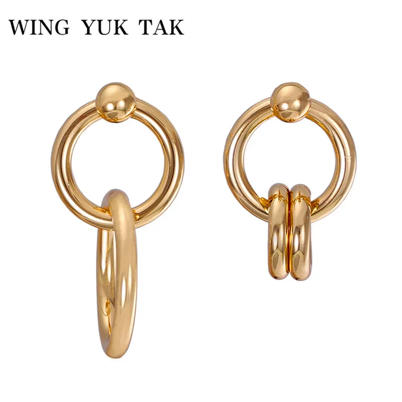 

wing yuk tak Gold Color Punk Earrings Unique Design Alloy Round Hollow Asymmetrical Stud Earrings For Women Party Jewelry
