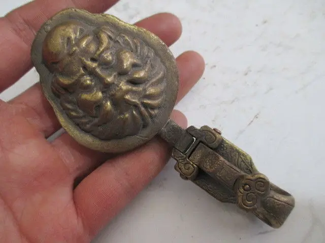 

Tibet antique brass ancient animal head belt buckle to ward off bad luck