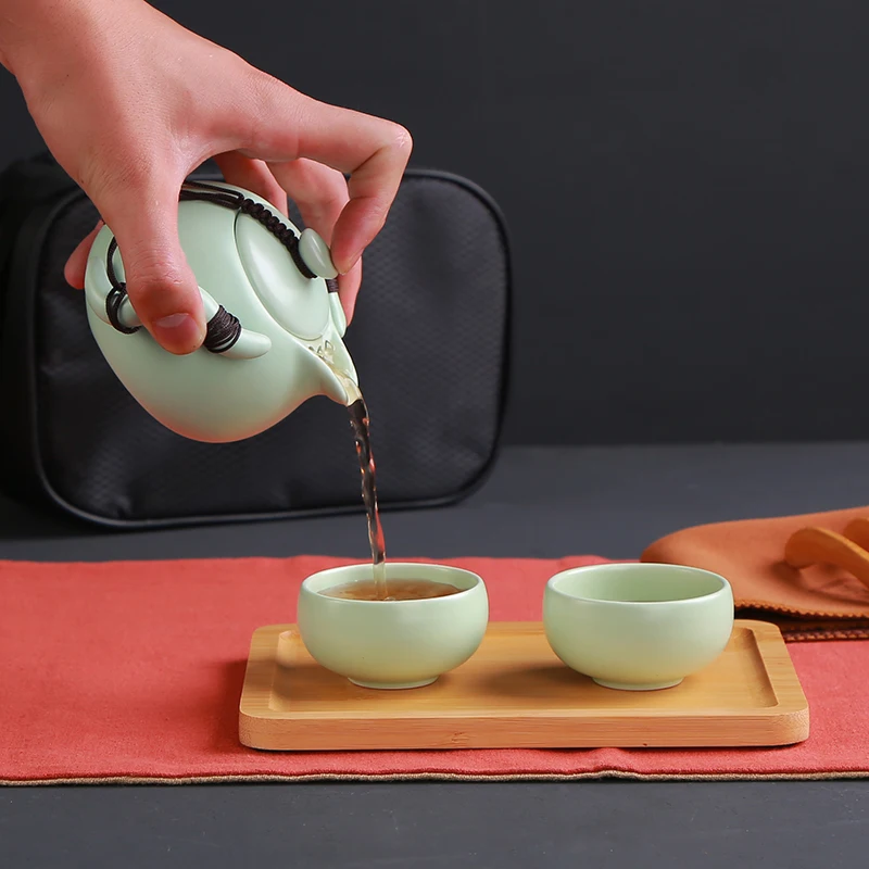 XING KILO Travel tea set portable bag home kung fu ceramic teapot fast customer a pot two or two cups gift custom logo XING KILO Travel tea set portable bag home kung fu ceramic teapot fast customer a pot two or two cups gift custom logo