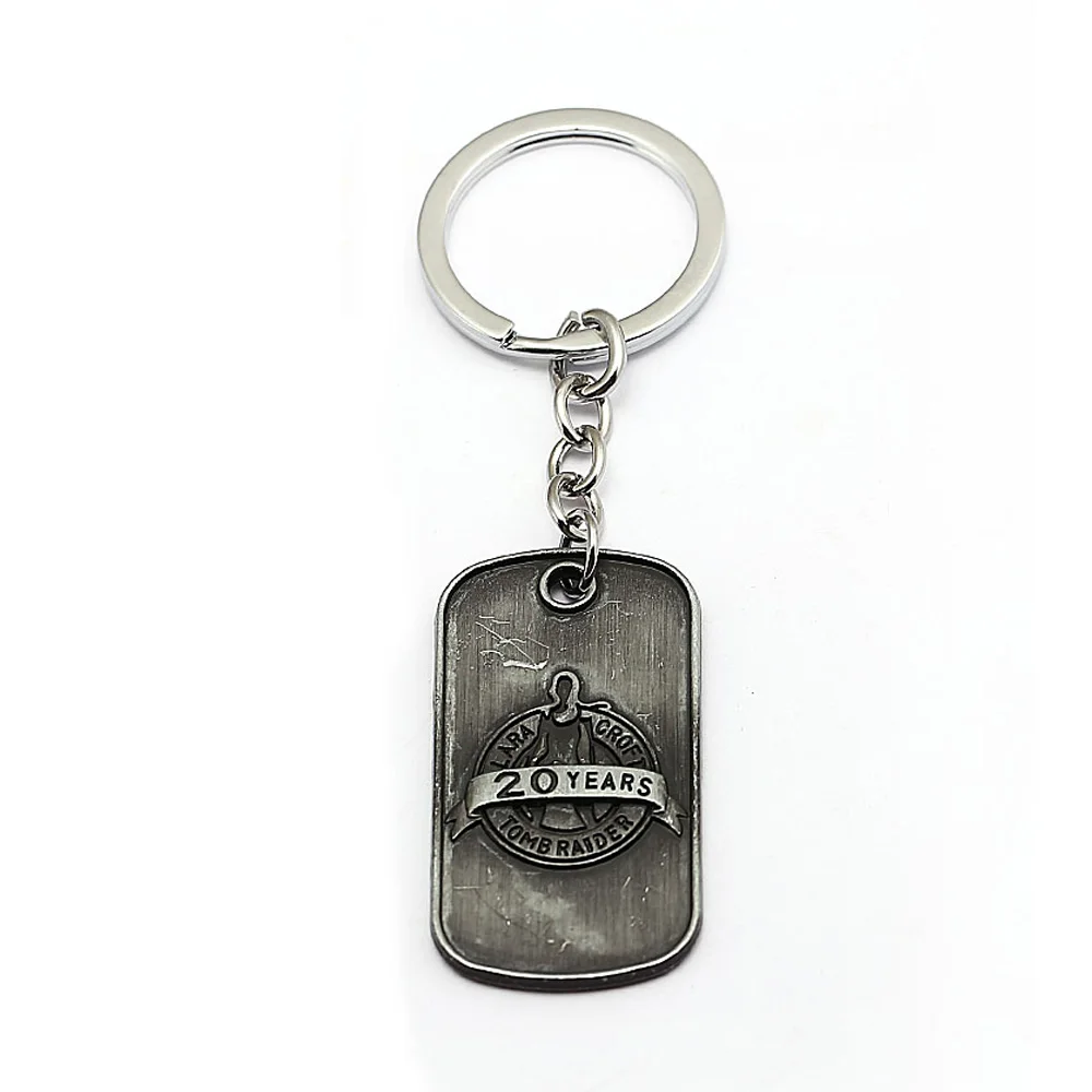 

Lara Croft Tomb Raider Keychain 20th Anniversary Edition Metal Pendant Dog Tag Keyring Bag Car Key Chain Chaveiro Movie Jewelry