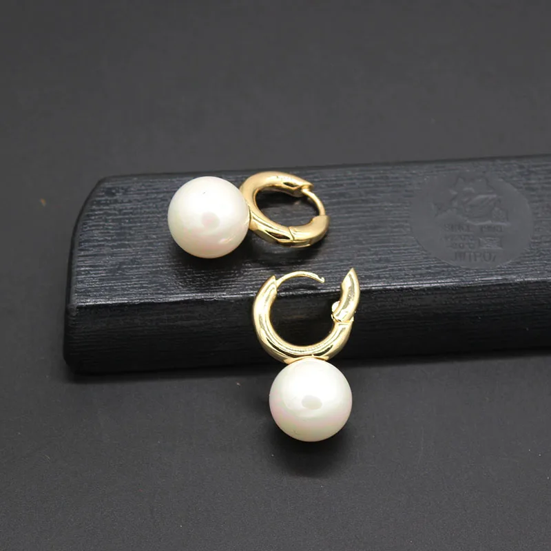 

Net red with the simple temperament wild exaggerated big pearl earrings Temperament exaggeration pearl circle ear stud 740