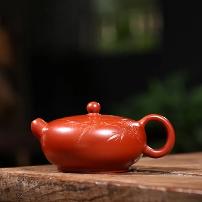 

2018 new style 250ml Yixing Ding Shu Town purple sand pot raw coal mine small coal kiln Zhu Yu jade teapot carved bamboo leaves