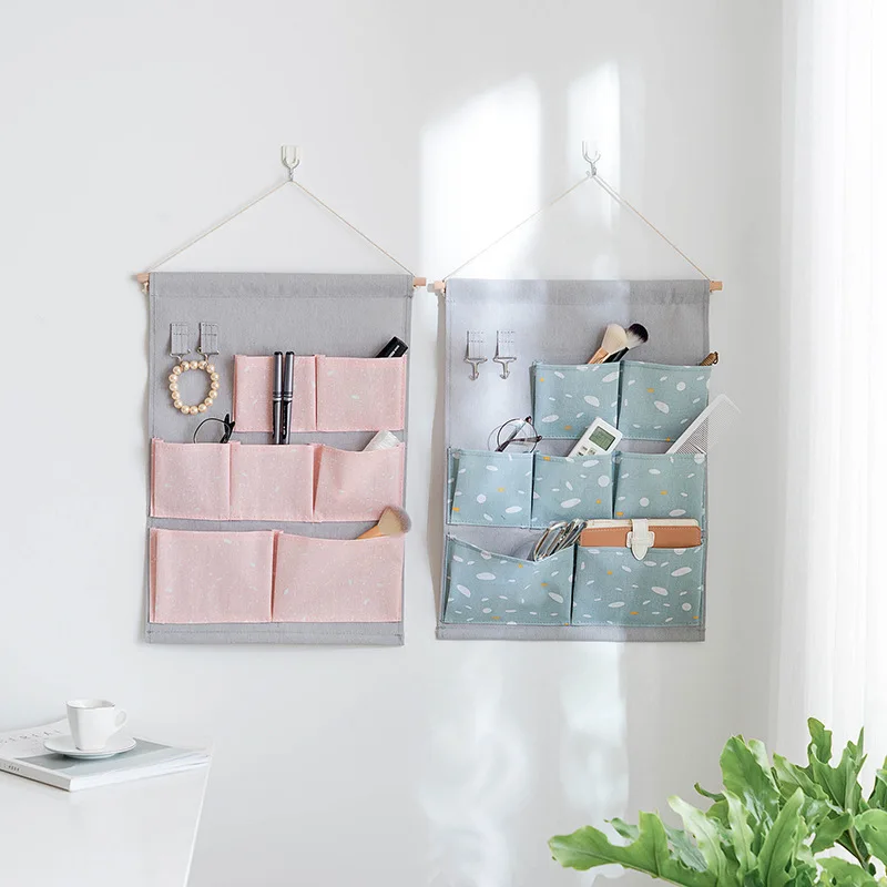 

Fashion snow printing Cotton Linen Hanging Storage Bag 7 Pockets Wall Mounted Wardrobe Hang Bag door Pouch lovely Toys Organizer