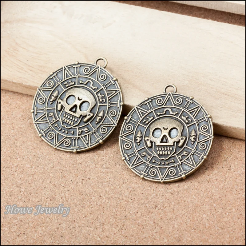 

2pcs ancient bronze Pirates of the Caribbean gold a compass Charms Skull fit DIY fashion Bracelet jewelry accessories A067