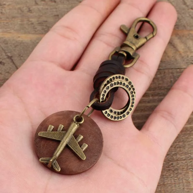 Porte-clés Vintage en cuir fait à la main, pendentif rond en bois Bronze avion, nouveau porte-clés de voiture