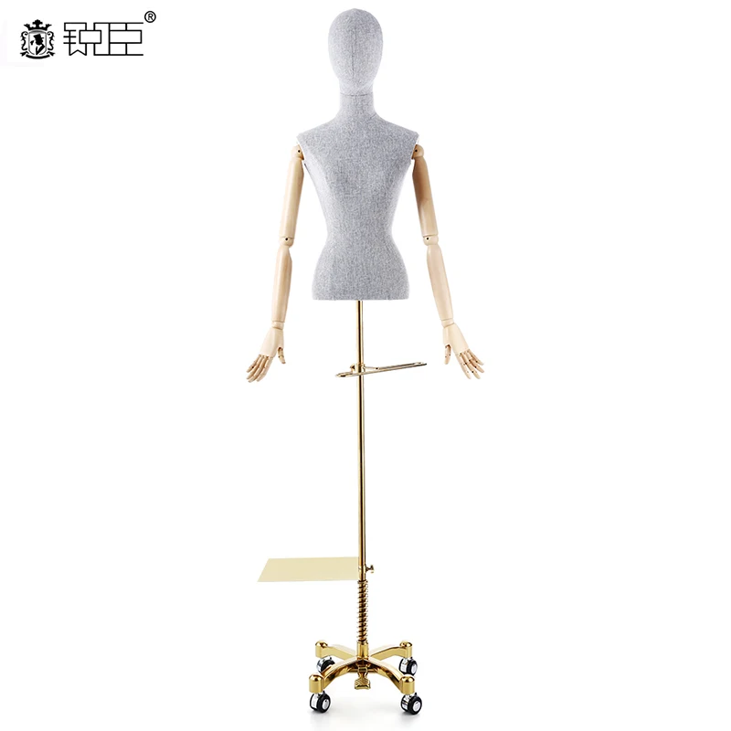 

mannequin torso linen covered with poseable arms Stainless steel holder with trolley wheel
