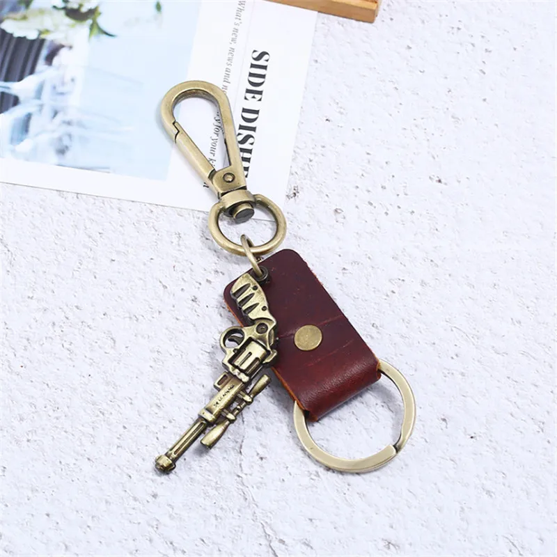 Fashion Men Revolver Bronze Pistol Weapon Keychain Leather Key Rings Newest Gun key Chain For Women Charm Jewelry Surprise Gifts Fashion Men Revolver Bronze Pistol Weapon Keychain Leather Key Rings Newest Gun key Chain For Women Charm Jewelry Surprise Gifts