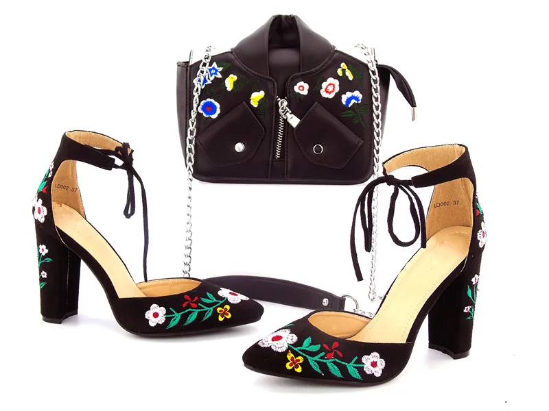

Black lace up shoes with chain bag
