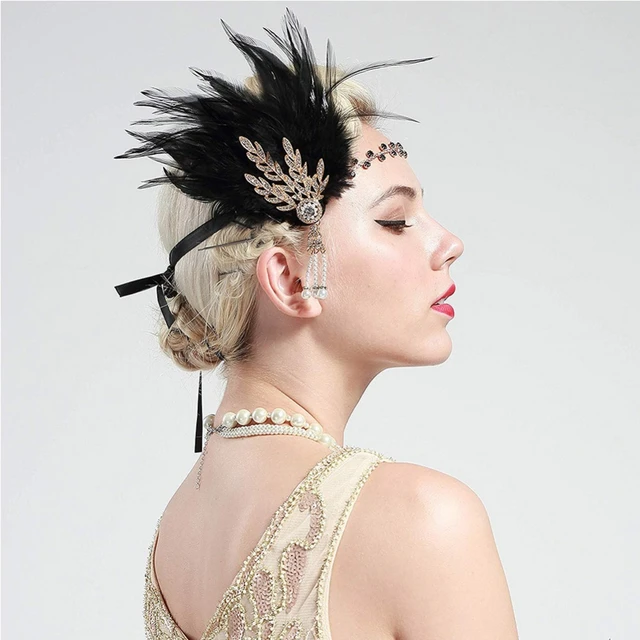 Great Gatsby style gold stands with palm leaves, feathers and pearls