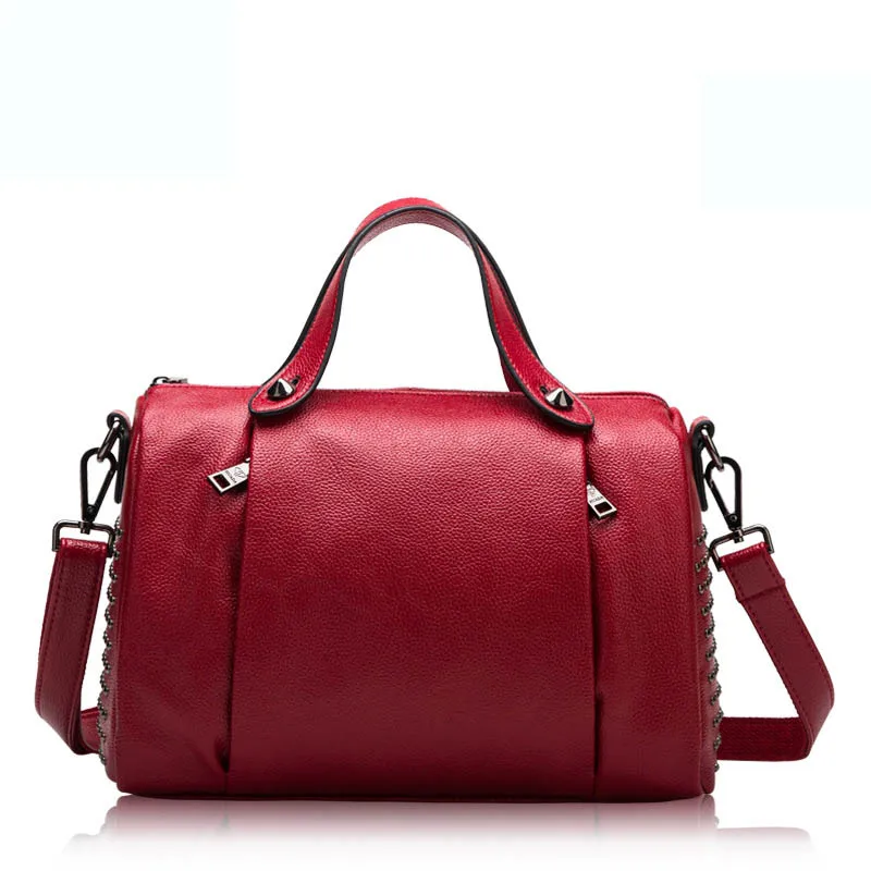 Ms. new European and American style wind rivet leather cowhide pillow bag Real leather white cross-type portable leather shoulde