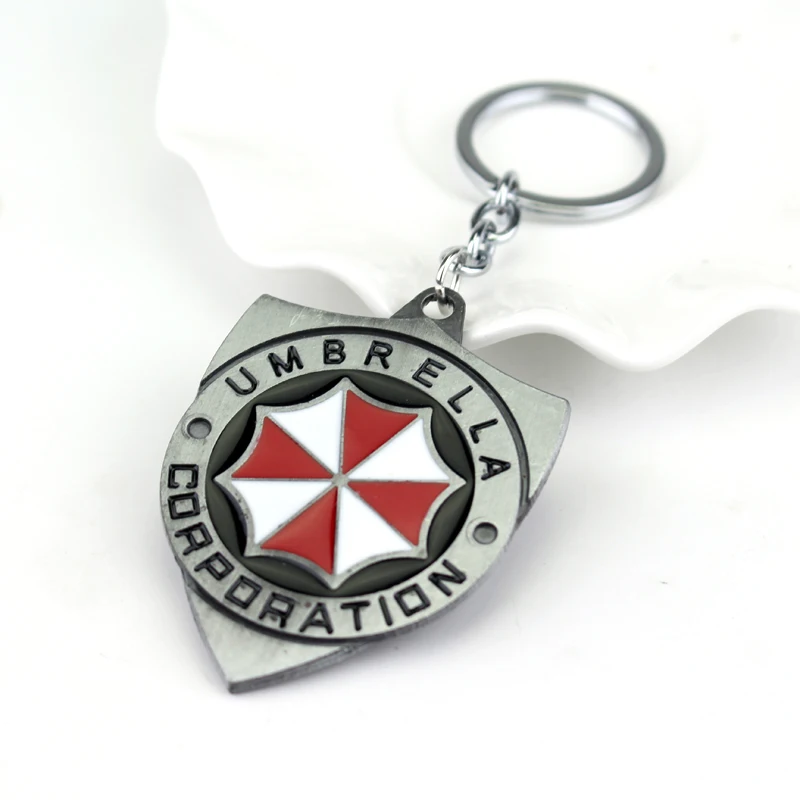 

Resident Evil Alloy Keychain Umbrella Corporation Logo shield shape Hoder For Fans Unique Movie Jewelry Accessories