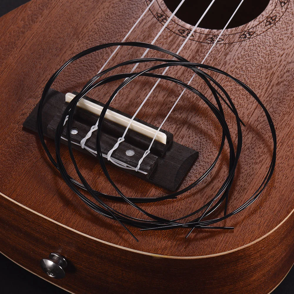 Alice AU046BK 4 шт. Струны для укулеле Ukelele набор струн(A-E-C-G) черный модифицированный нейлон для баритона/Сопрано/тенор/концертная укулеле
