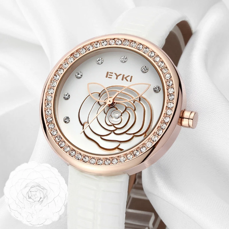 Prix pour De luxe Eyki Marque Dames En Cuir Véritable Montres À Quartz Relief Fleurs Plaqué Or Cadran Montres Pour Femmes Relogio Feminino Prix pour De luxe Eyki Marque Dames En Cuir Véritable Montres À Quartz Relief Fleurs Plaqué Or Cadran Montres Pour Femmes Relogio Feminino