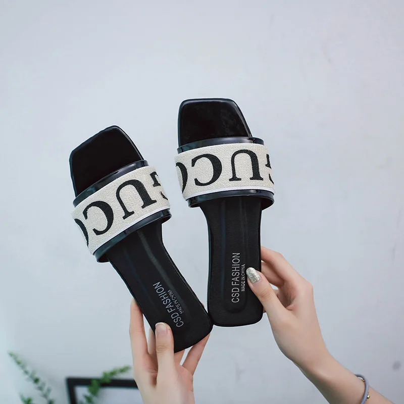 

Summer new simple square head flat with a word drag women wear fashion wild lazy sandals and slippers trend