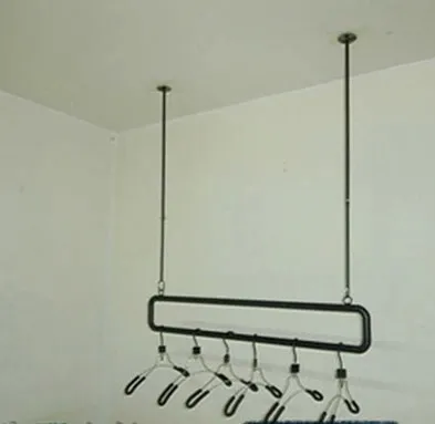 wrought iron wall clothing rack on the clothing store shelves, condole carries on the