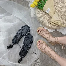 Roman sandals female 2019 new wild flat cross strap beach shoes