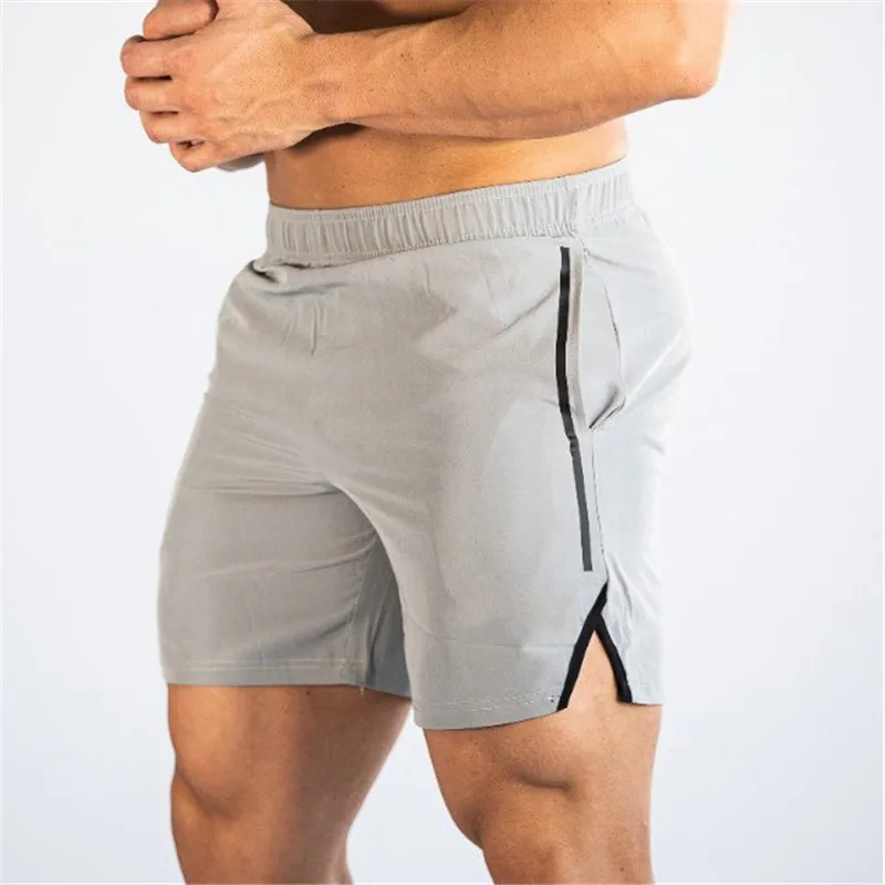 Новые летние мужские брендовые шорты для фитнеса бодибилдинга, дышащие быстросохнущие сетчатые шорты, спортивные штаны для бега, модные шорты