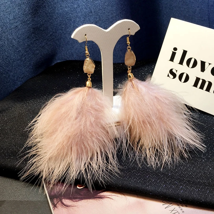 

Temperament super fairy feather earrings female Europe and America exaggerated atmospheric earrings long tassel personality tide