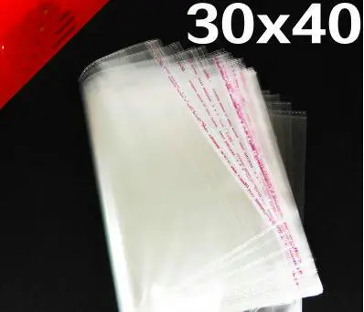 

Freeshipping wholesale 50pcs 30*40 cm Clear Self Adhesive Seal Plastic opp bags