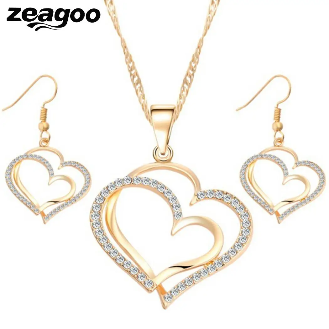 Сережки в виде сердечек. Серьги в виде сердечек. Сережки сердечки. Круглые серьги с подвесками сердечками. Серьги подвески сердечки.