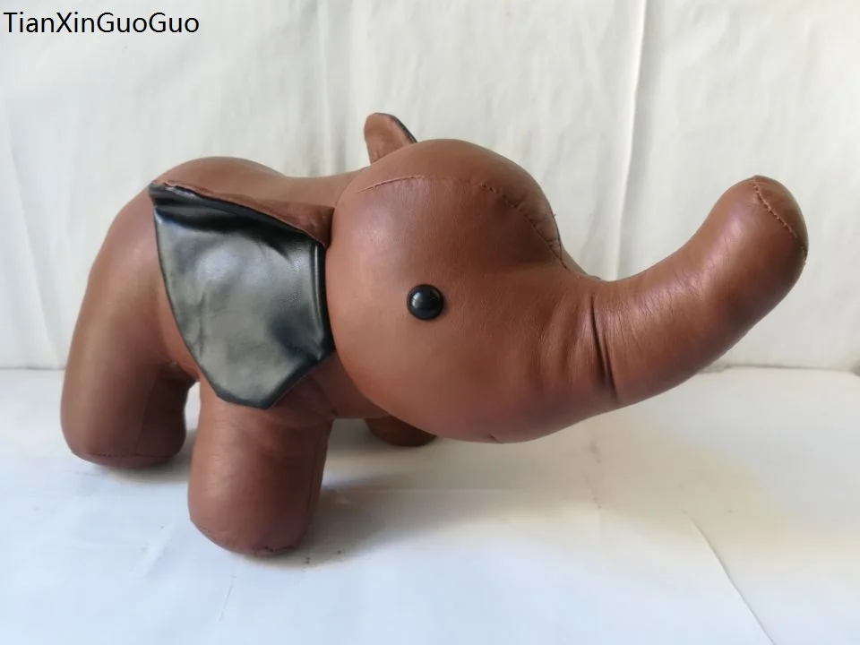 

Игрушка плюшевая в виде коричневого слона, 32x20 см