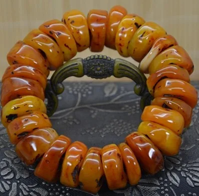 Amber beeswax beads bracelet with the hand prayer beads photo
