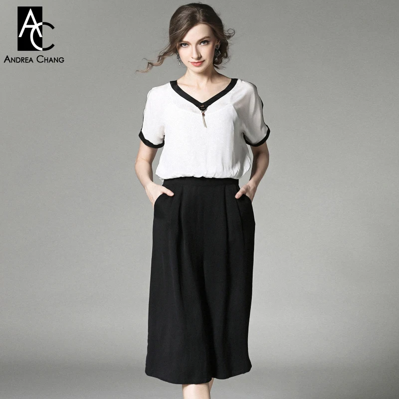 black jumpsuit with white top