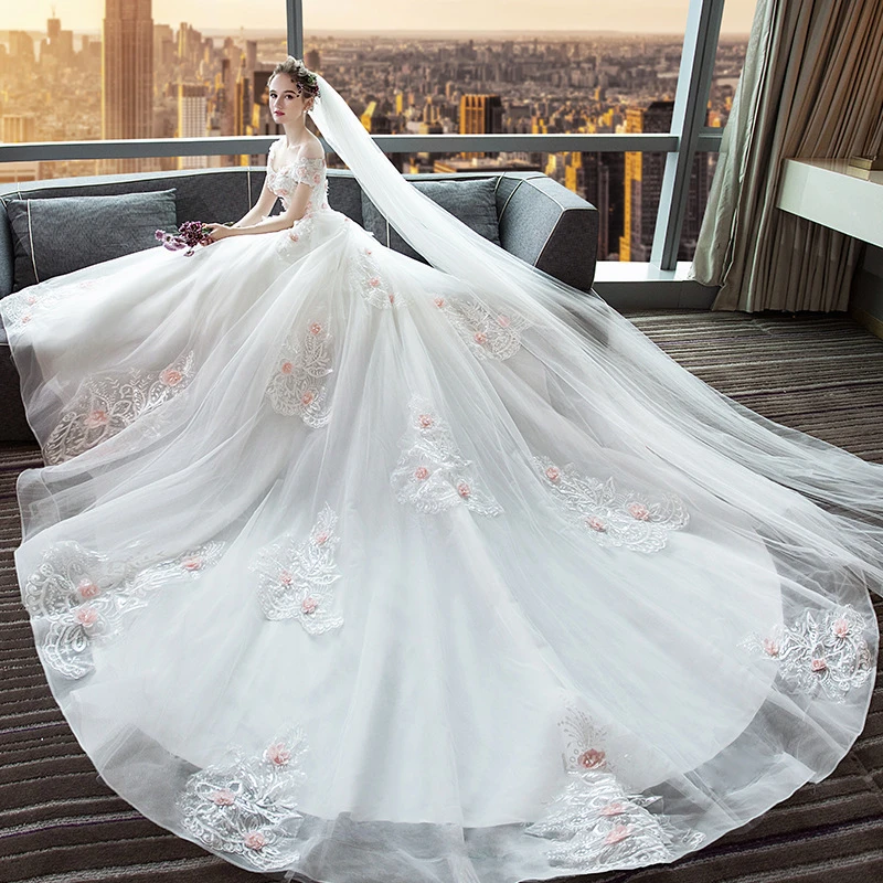 white wedding dress with pink flowers