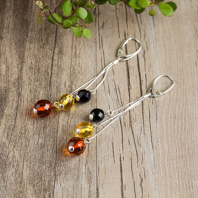 

Elegant and soft natural amber beeswax sterling silver and more precious gold blood Po earrings specials Free shipping