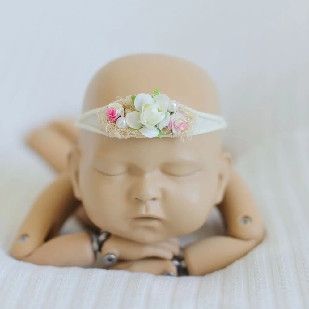 newborn posing doll