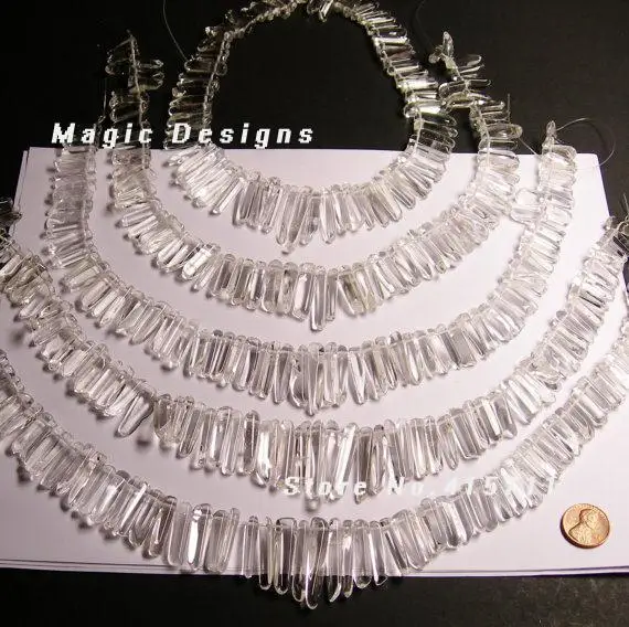 

Quartz crystal points - top drilled - mix size - full strand - polished clear quartz BE245