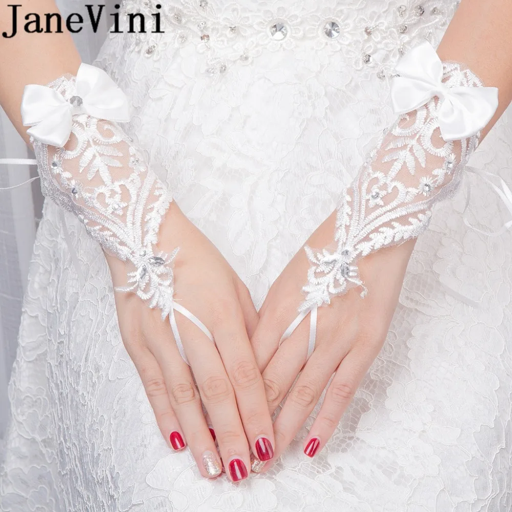 

JaneVini Short Wrist Length Wedding Gloves for Bride Beaded Bow Lace Bridal Gloves Fingerless Accessory Hochzeit Handschuh 2018