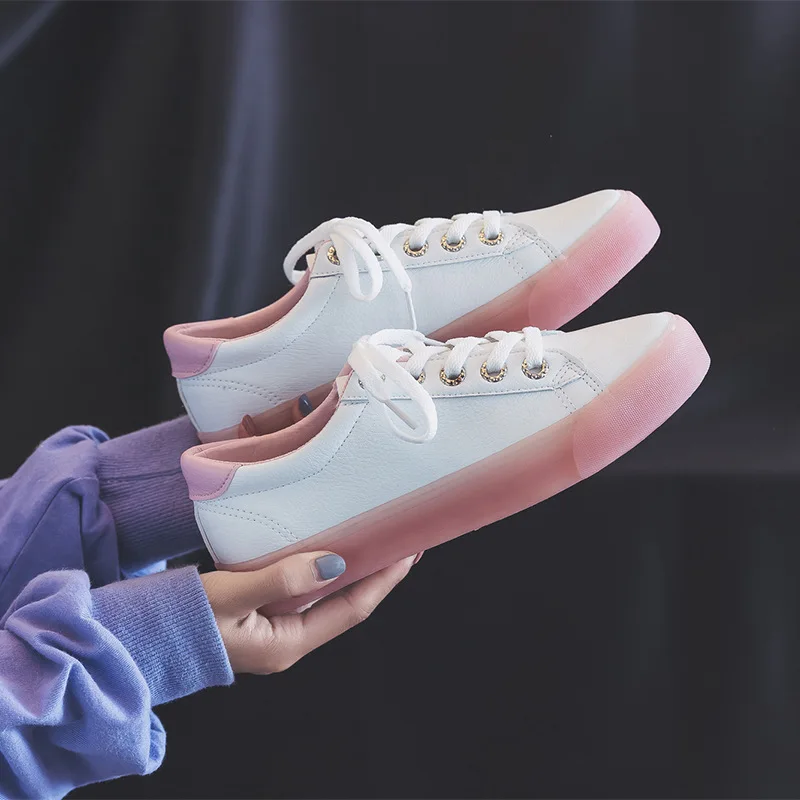 white sneakers with pink soles