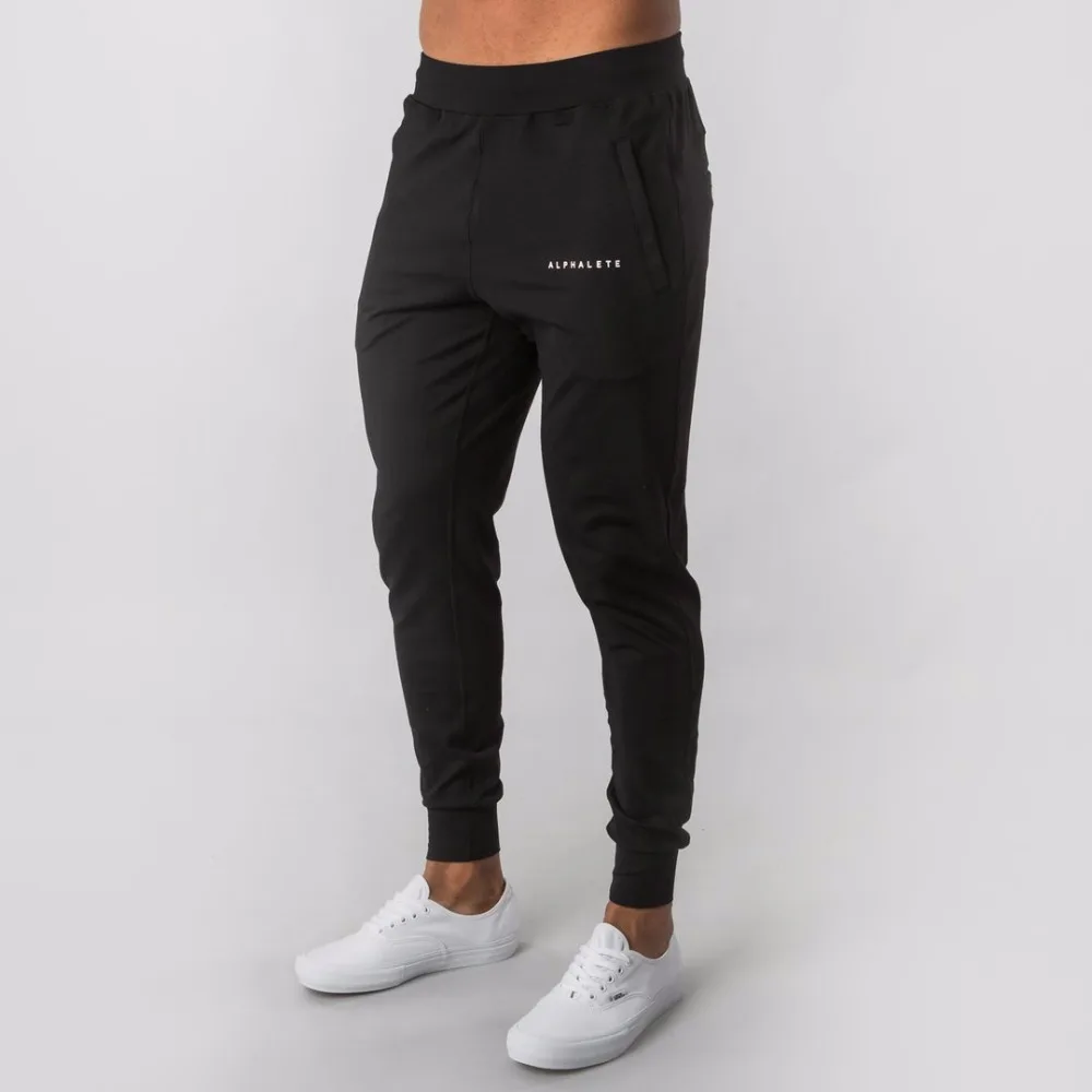 ALPHALETE جديد نمط رجل العلامة التجارية عداء ببطء Sweatpants رجل الجمنازيوم تجريب اللياقة البدنية سراويل قطنية الذكور عارضة الأزياء نحيل السراويل ال...