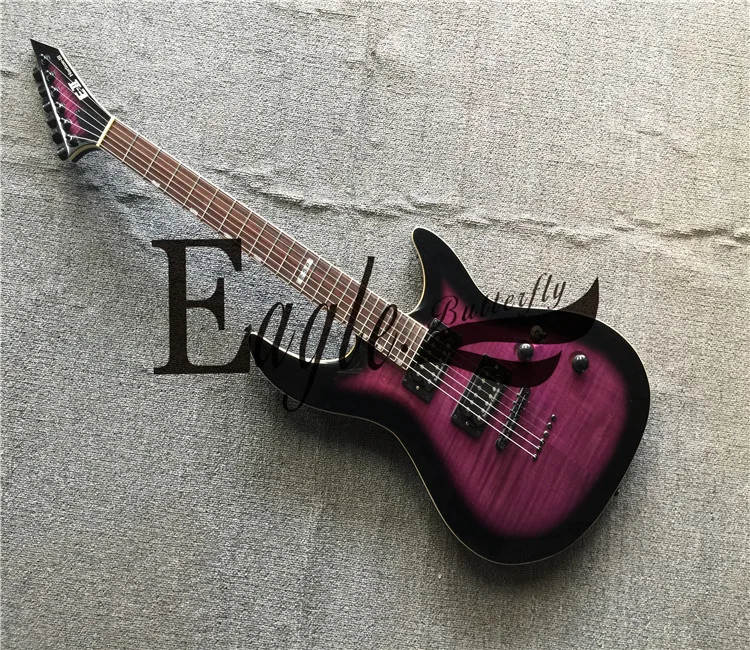 

Eagle. Butterfly,Twenty-four purple Flame Maple veneer electric guitar is fixed and then pierced the stringed bridge in stock.